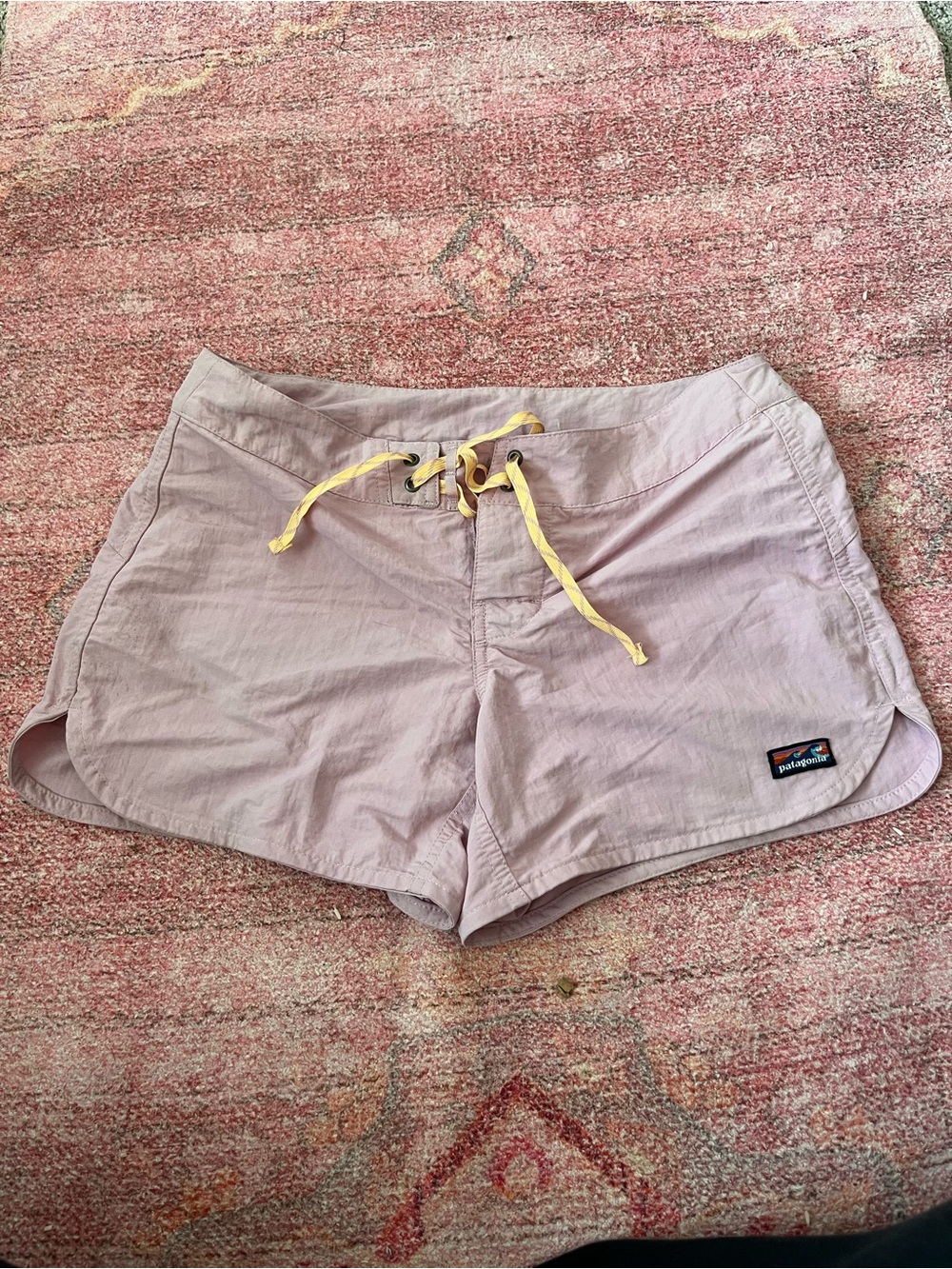 Patagonia Women's Light Purple board shorts with orange Drawstring